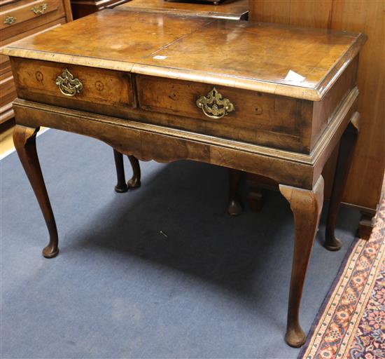 An early 18th century banded walnut side table, with later apron and legs W.100cm